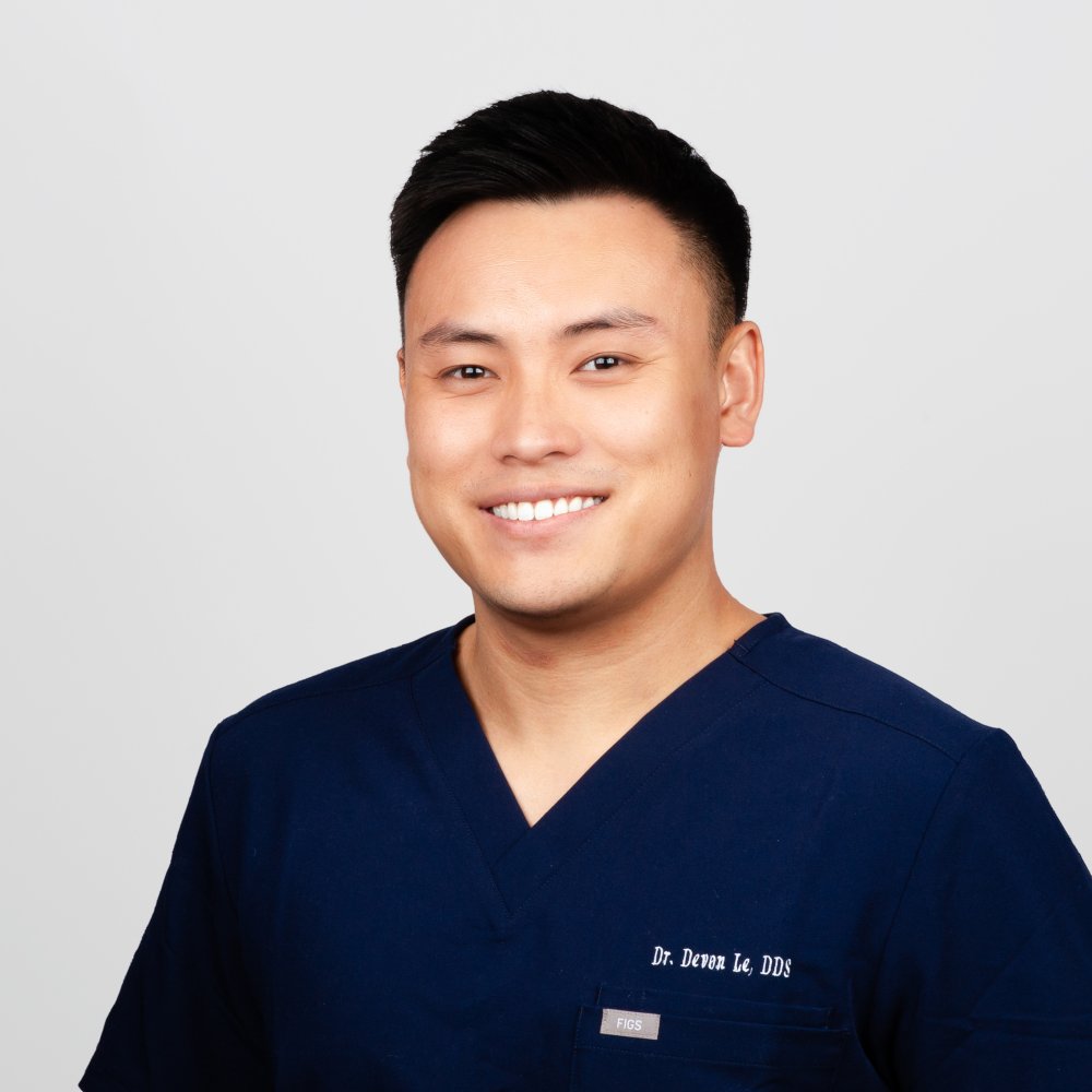 Dr. Devon Le, DDS, Owner and Dentist, Mt. Hermon Dental Care, Scotts Valley Dr. Devon Le, DDS, owner and dentist at Mt. Hermon Dental Care in Scotts Valley, CA, smiling in navy scrubs